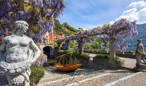 Villa d'Este - Wisteria statues and Lucia boat - Book on ClassicTravel.com