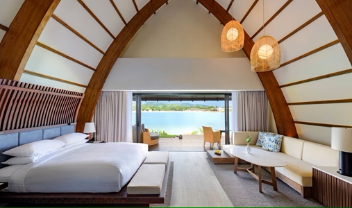 Fiji Marriott Resort Momi Bay - Lagoon Bure Villa Bedroom - Book on ClassicTravel.com